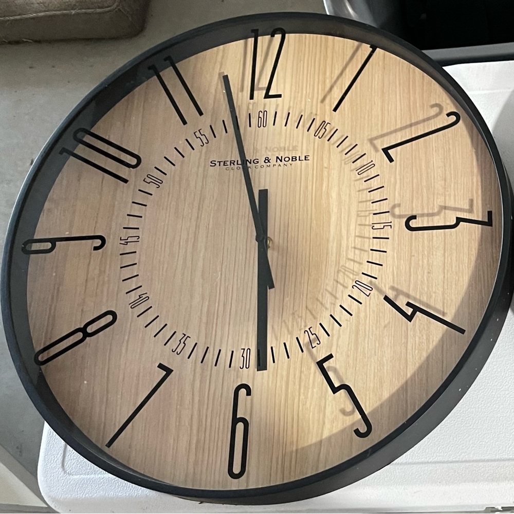 Identical wall clocks, round, large, black frame, brown interior